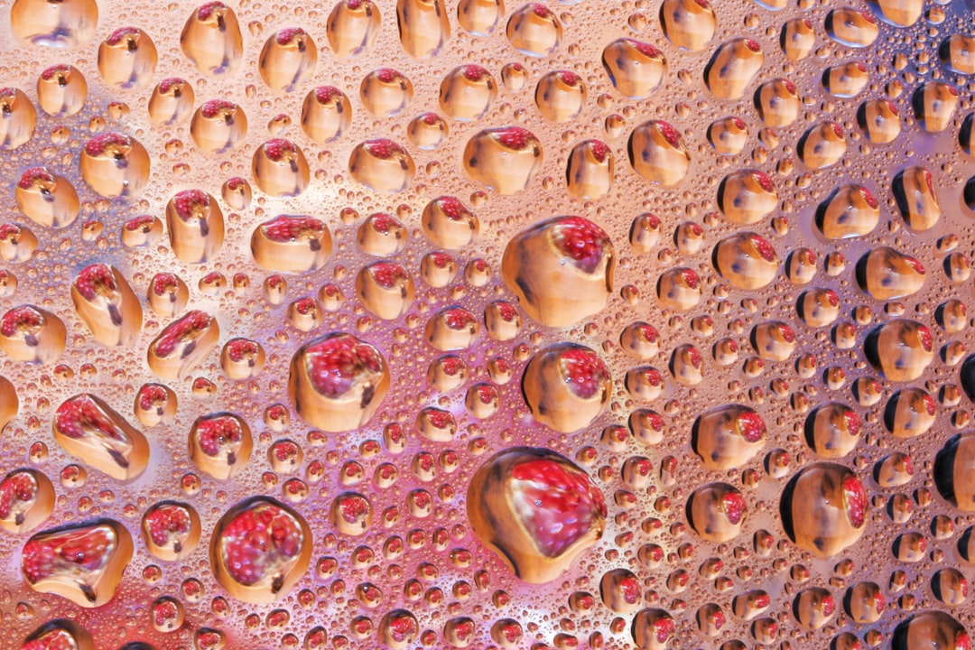 a close up of water droplets on a surface