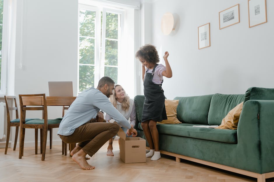 A joyful family unpacking boxes in their new home, embracing togetherness.