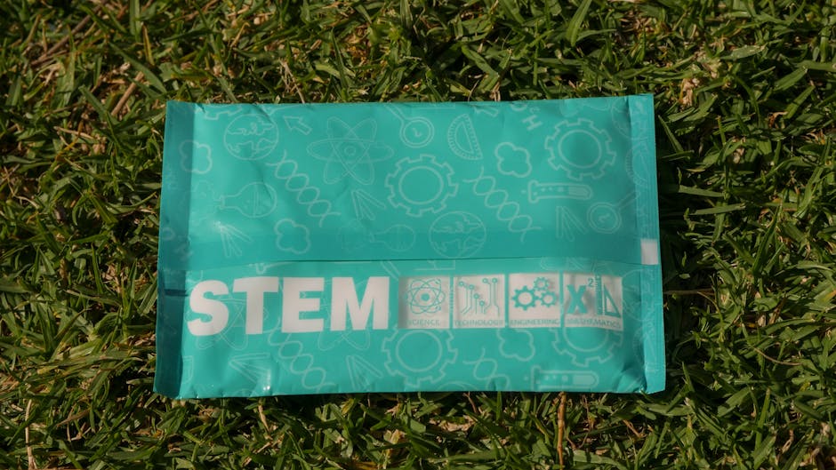 STEM-themed bag on grass promoting science, technology, engineering, and math.